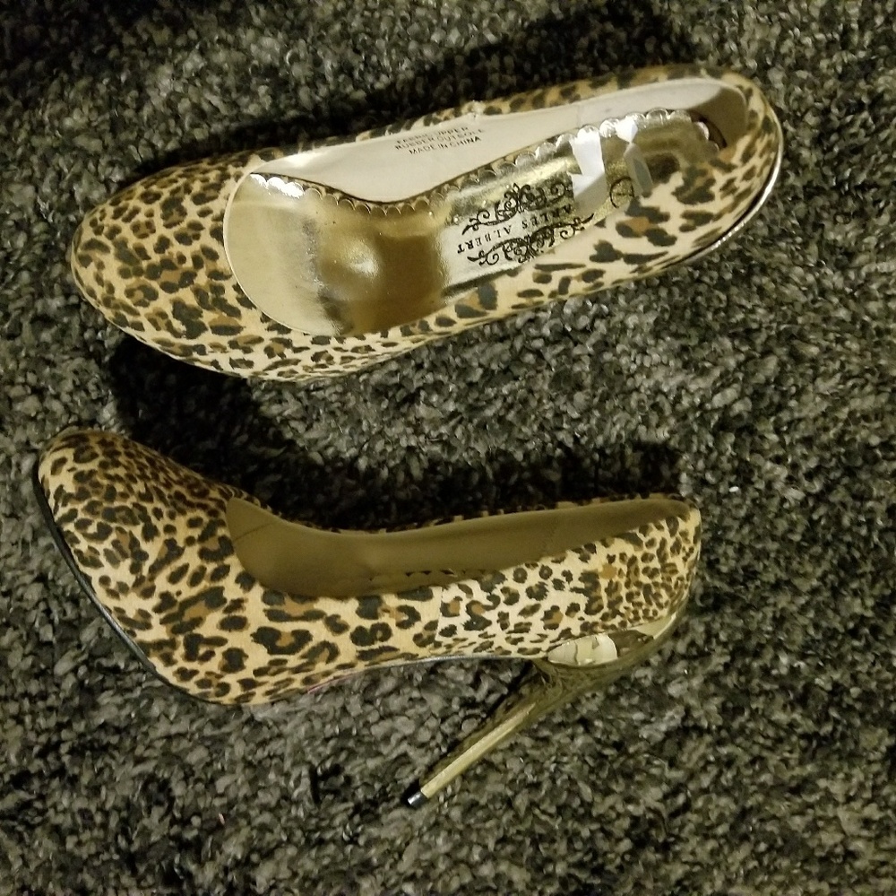 Leopard pumps with gold heel.